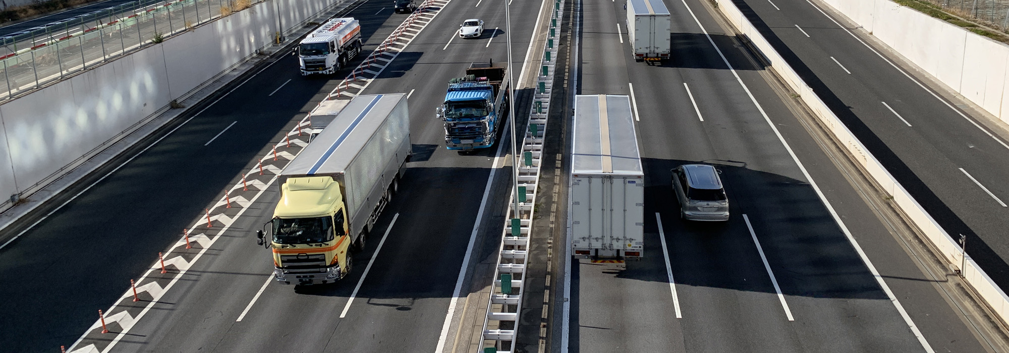 trucks and cars driving on highway