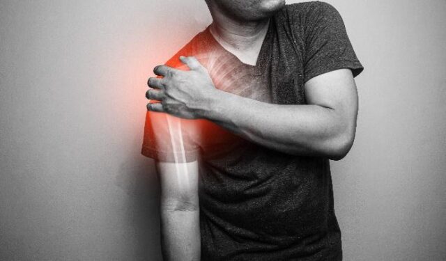 man holding shoulder
