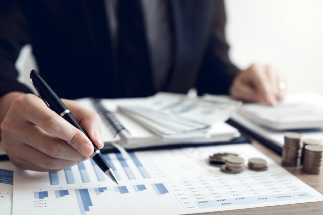 man calculating investments